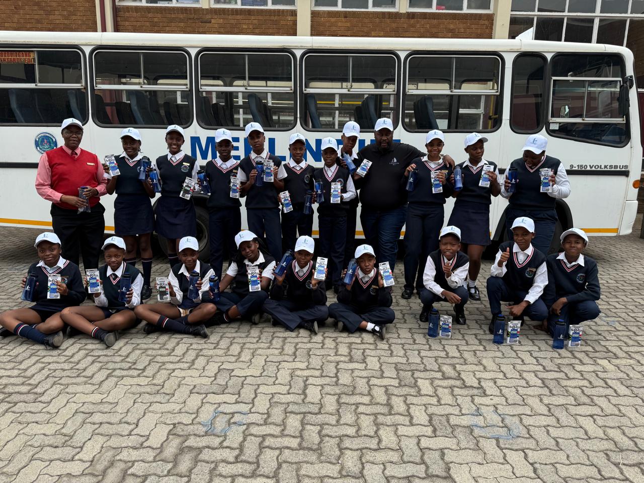 Learners receiving school supplies at Merlin Park